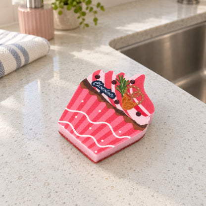 Pink cupcake kitchen sponge with a flat Chocolate print, striped wrapper design and separate backing.